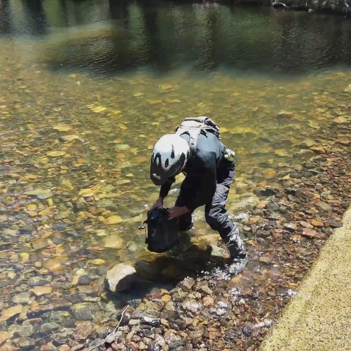 Durable soft roll bag water test by motorcyclist