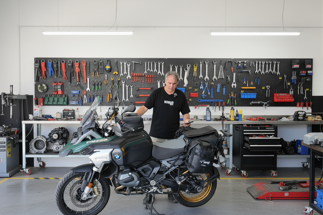 Kurt Founder Nomad Moto 1300 GS with Strzeelcki Adjustable Rackless fitted standing next to a motorcycle in a garage with vehicles and equipment in the background